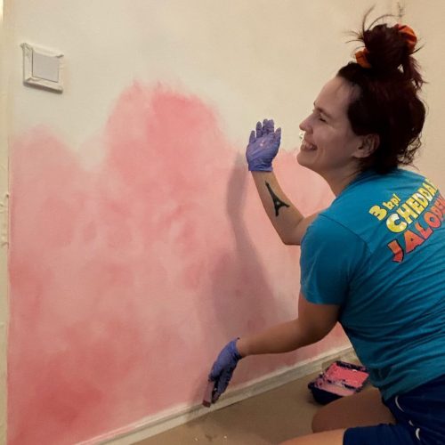 Me painting my wall